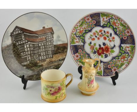 A Royal Doulton porcelain plate decorated with Little Moreton Hall, Cheshire, together with a modern Imari dish, and two piec