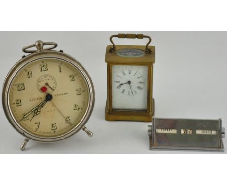 An early 20th Century French brass carriage timepiece together with a Goliath repeater alarm clock and a chrome desktop perpe