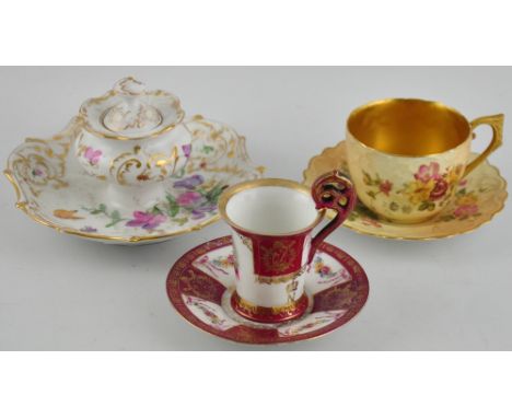 A Royal Worcester blush teacup and saucer, together with a Sevres-style coffee cup and saucer, and a German lidded inkstand (
