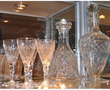A cut glass decanter with associated stopper, together with a moulded glass mallet-shaped example, and five cut glass sherry 