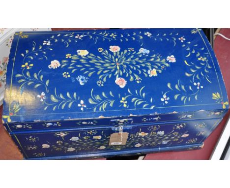 A Swiss style blue painted domed top trunk painted with floral sprays, W: 70cms