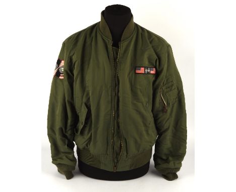The Rolling Stones - bomber jacket, green with orange lining, size L, label reads Rolling Stones '89