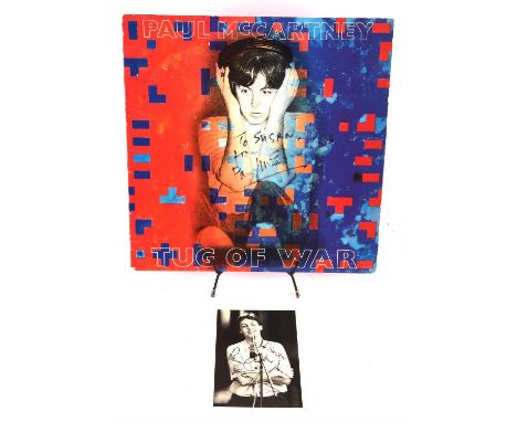 Paul McCartney signed record, Tug of War 1982 solo album, together with MPL Paul McCartney promo postcard. Both are signed To