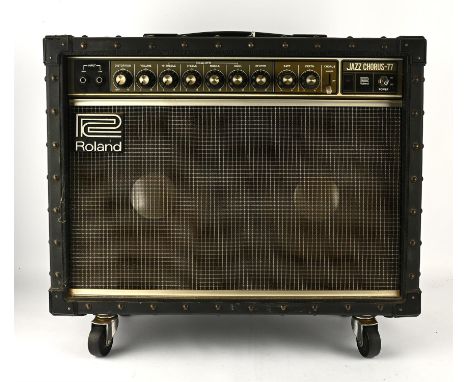 Guitar Amplifier - Roland Jazz Chorus -77. Twin speaker amp with reverb / chorus. Mounted on wheels. Condition Report:  Seems