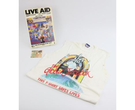 Live Aid - T-shirt (sleeves cut off), ticket and programme from the famous 1985 concert at Wembley Stadiu. Condition Report: 
