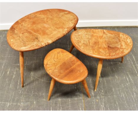 A NEST OF THREE LIGHT ERCOL 'PEBBLE' OCCASIONAL TABLES Condition Report : joints are all solid, however significant water dam