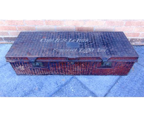 MILITARIA - A METAL TRAVEL TRUNK  the lid with an applied engraved plaque and further painted 'Capt. R.S. Le Bas / Somerset L