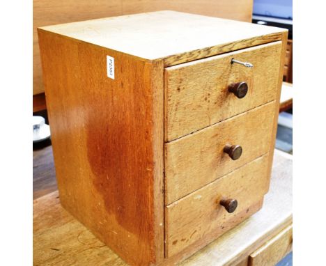 A SMALL GORDON RUSSELL THREE DRAWER OAK CHEST, 38cm wide 38cm deep 46cm high, metal label to reverse 'GORDON RUSSELL LTD., BR