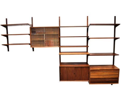 POUL CADOVIUS: A DANISH ROSEWOOD 'SYSTEM CADO' SUITE OF WALL MOUNTED FURNITURE comprising: six shelves 30cm deep; three shelv