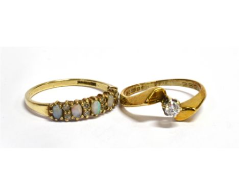 TWO DIAMOND SET 9CT GOLD RINGS  Comprising a diamond single stone, size K ½; and an opal and diamond set half eternity ring, 