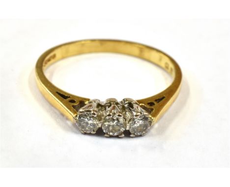 A DIAMOND THREE STONE 18CT GOLD RING The three small round brilliant cut diamond with a total weight of approx. 0.33 carats, 