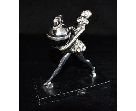 A 1930S RONSON ART DECO TABLE LIGHTER  the spherical lighter held by a young girl in striding pose with ruff collar and match