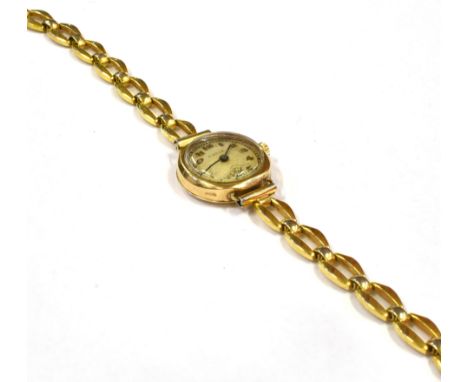 A LADIES PIERCE 9CT GOLD VINTAGE WATCH  on a plated bracelet, the c1920s watch with .375 mark to outer case, the case size 24