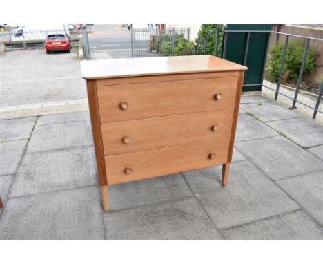 GORDON RUSSELL FOR HEALS:  a three drawer chest, each drawer with pull handles, the top drawer with ivorine inset roundel 'HE