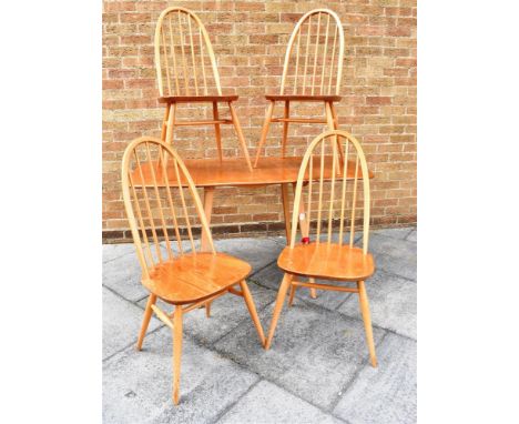 A LIGHT ERCOL DROP-LEAF DINING TABLE  and set of four stickback dining chairs, the table 74cm deep 137cm long fully extended 