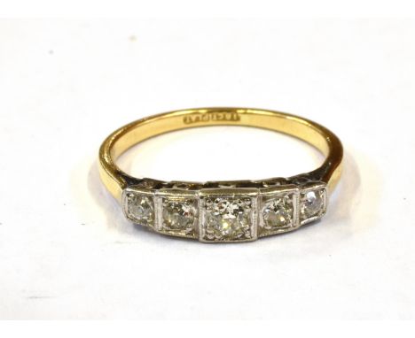 AN ART DECO DESIGN DIAMOND FIVE STONE RING  the graduating round old cut diamonds carre set with a total diamond weight of ap