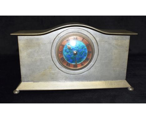LIBERTY &amp; CO: A TUDRUC PEWTER MANTLE CLOCK  the 3.5' dial with green and turquoise enamelled decoration, and copper chapt