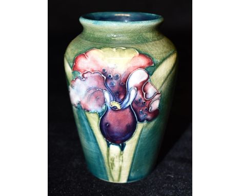 A MOORCROFT POTTERY VASE DECORATED IN THE 'ORCHID' PATTERN  on a green ground, paper label to base, 9.5cm high Condition Repo