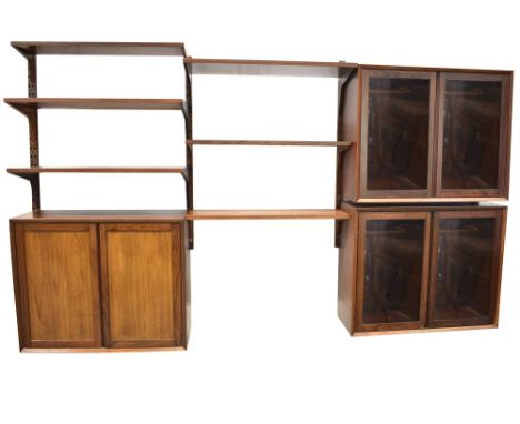 POUL CADOVIUS: A DANISH ROSEWOOD 'SYSTEM CADO' SUITE OF WALL MOUNTED FURNITURE comprising: three shelves 22cm deep; three she