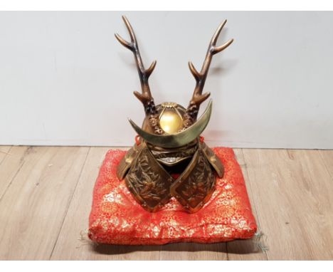 REPRO JAPANESE SAMURAI KABUTO DEER HELMET DISPLAYED ON ORIENTAL STYLE CUSHION