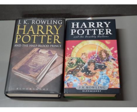 TWO FIRST EDITION HARRY POTTER HARDBACK BOOKS WITH PROTECTIVE COVERS THE DEATHLY HALLOWS AND THE HALF BLOOD PRINCE