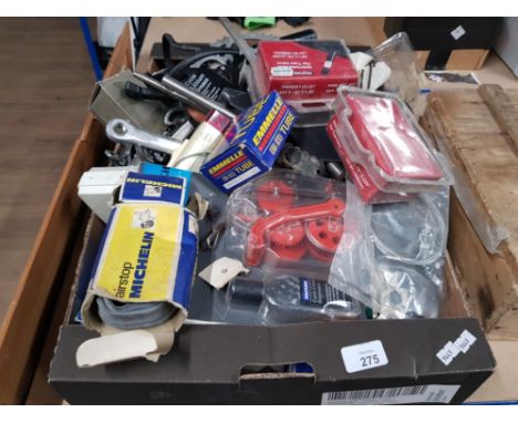 A BOX OF ASSORTED TOOLS INC INNERTUBES AND OTHER BIKE PARTS
