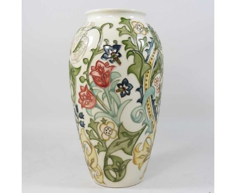 A large modern Moorcroft vase, painted with scrolling floral designs, on a cream ground, impressed marks to base31cm high