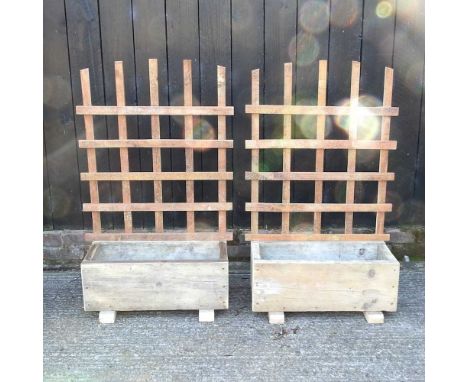 A pair of small wooden garden planters, with trellis67w x 34d x 104h cm