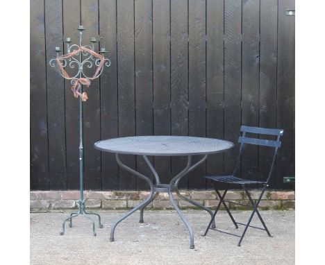A black painted metal garden table, together with a chair and a candelabra (3)