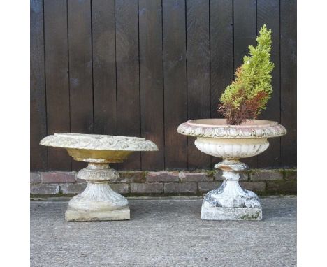 An ornate garden urn on stand,70cm wide, together with a smaller terracotta urn