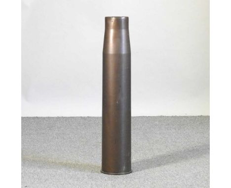 A brass artillery shell case stick stand, 73cm high