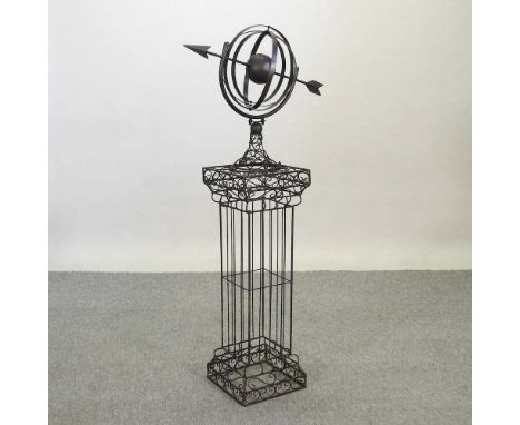 A black painted metal garden armillary26w x 26d x 120h cm