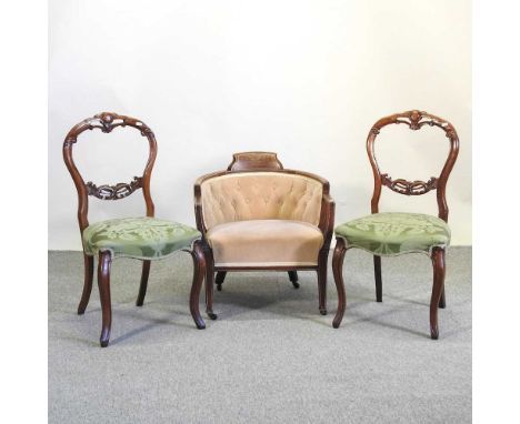 An Edwardian button back tub chair, together with a pair of Victorian balloon back chairs (3)