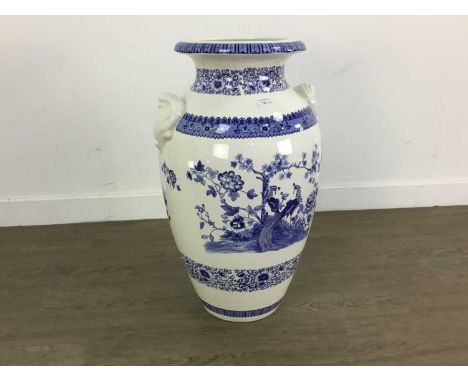 20TH CENTURY BLUE AND WHITE VASE AND A DECORATIVE SUN DIAL the vase decorated with flowers and foliageChinese vase 61cm high 