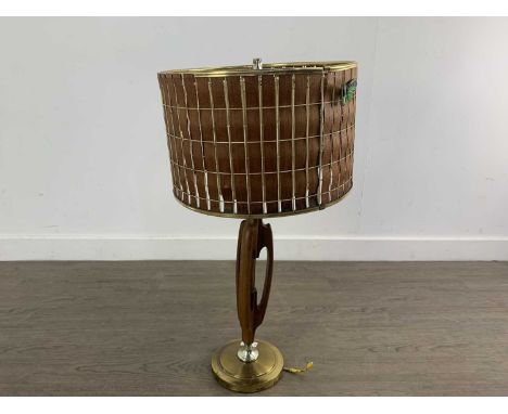 MID CENTURY TABLE LAMP C.1970 in teak with a brass lacquered circular base and with a woven shade66cm high 