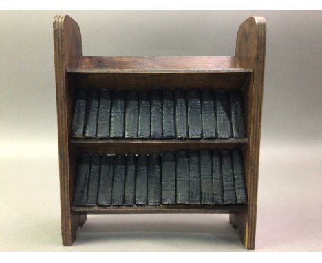NOVELTY MINIATURE BOOK STAND WITH MINIATURE BOOKS AND LAMPS including a glass lamp with shade, as well as a decorative green 