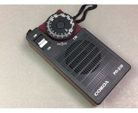 VINTAGE RUSSIAN RADIO ALONG WITH TWO WATCHES AND A PAIR OF FOOTBALL BOOTS  the radio by Cokoa with original box, two Timex di