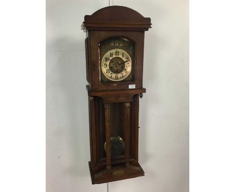 ART NOUVEAU OAK WALL CLOCK LATE 19TH CENTURY with three train eight day movement, with silvered Arabic numeral chapter ring o
