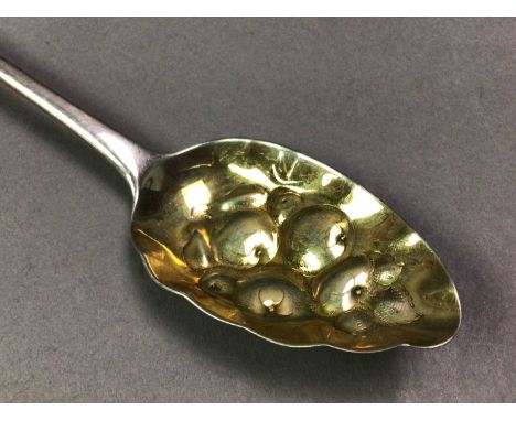 GEORGE III SILVER SERVING SPOON the oval gilt bowl embossed with fruit, along with a silver caddy spoonQty: 2