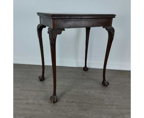 MAHOGANY TURNOVER CARD TABLE EARLY 20TH CENTURY  with carved detail on paw feet 74cm high, 61cm wide, 40cm deep 
