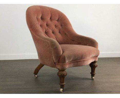 VICTORIAN OAK FRAMED NURSING CHAIR upholstered in button back pink dralon, on turned tapering forelegs