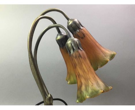 ART NOUVEAU STYLE LAMP 20TH CENTURY with three shades in the form of flowers, the base modelled as lilly pads40cm highGood co
