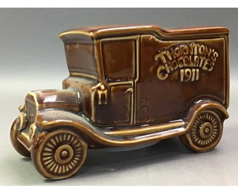 THORNTONS CHOCOLATES MONEY BOX AND THREE OTHERS the money box modelled in the form of a vintage truck with box, along with a 