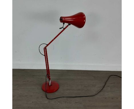 ANGLEPOISE LAMP IN THE STYLE OF HERBERT TERRY finished in red and with a circular base