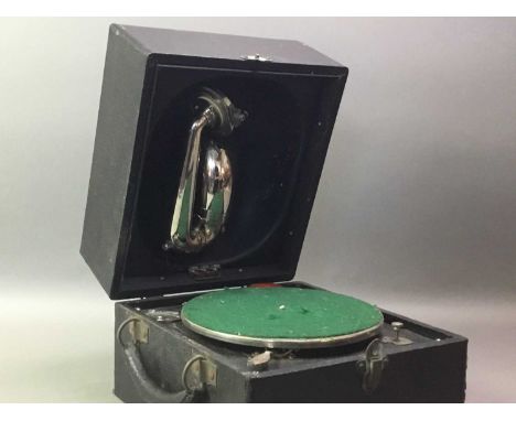 PORTABLE RECORD PLAYER cased, with album of vintage records
