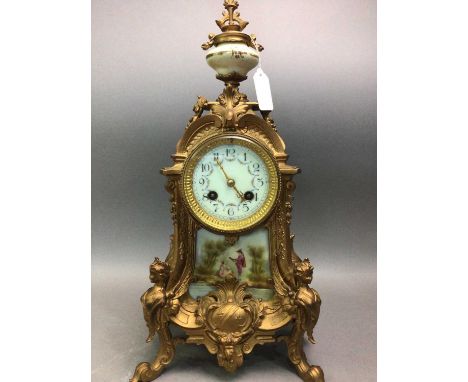 FRENCH MANTEL CLOCK 20TH CENTURY in gilt metal, with urn-shaped finial, the porcelain panel decorated with a figural scene, o