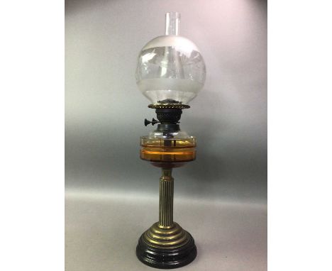 VICTORIAN BRASS OIL LAMP with glass chimney and reservoir, the shade etched with foliage, over brass column to circular base