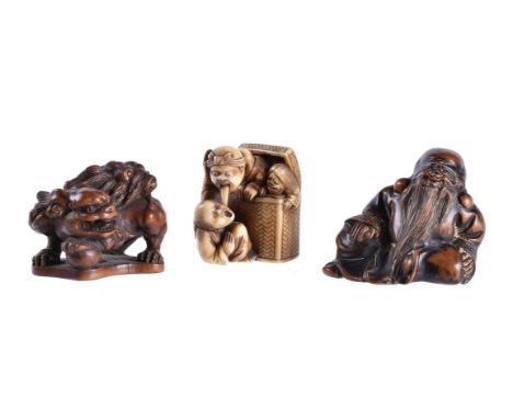 A Wood Netsuke of Fukurokuju, the bearded figure reclines dressed in a lengthy robe, signed, 18th Centuryi; A Wood Netsuke of