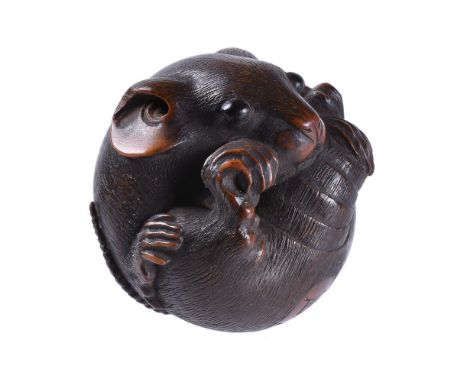 Masanao of Yamada: A Good Boxwood Netsuke of a coiled rat in typical compact form, it grasps its tail which winds around its 