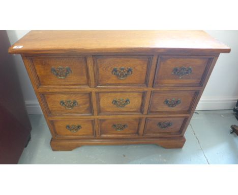 An antique style chest of nine drawers raised on bracket supports - 87cm x 34cm x Height 68cm
